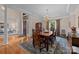 Formal dining room boasting hardwood floors, a chandelier, and access to the foyer at 10317 Clubhouse View Ln, Mint Hill, NC 28227