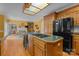 Kitchen with breakfast bar and appliances open to living room with fireplace at 10317 Clubhouse View Ln, Mint Hill, NC 28227