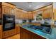 A well-equipped kitchen with an island cooktop and plenty of cabinet storage space at 10317 Clubhouse View Ln, Mint Hill, NC 28227