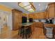 Bright kitchen with wood cabinets, center island and breakfast bar at 10317 Clubhouse View Ln, Mint Hill, NC 28227