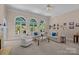 Spacious living room featuring arched windows, neutral decor, and ample natural light at 10317 Clubhouse View Ln, Mint Hill, NC 28227