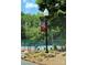 Close-up view of tennis courts with Olde Sycamore banner and landscaping at 10317 Clubhouse View Ln, Mint Hill, NC 28227