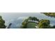Scenic aerial view of the golf course, lake, and lush green landscaping at 104 Bunker Way # 1001, Mooresville, NC 28117