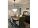 Elegant dining room featuring a modern chandelier and stylish decor with seating for six at 104 Bunker Way # 1001, Mooresville, NC 28117