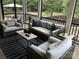 Comfortable screened porch with neutral furniture and natural light overlooking the landscaped backyard at 104 Bunker Way # 1001, Mooresville, NC 28117