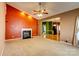 Spacious living room features a fireplace and an open floor plan with neutral carpet at 10927 Chrudan Dr, Charlotte, NC 28262