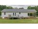 Exterior of home with gray siding, a deck, a covered patio and lots of open lawn area at 1274 Carpenter Springs Dr, Dallas, NC 28034