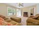 Cozy living room with large windows and neutral tones with plush seating at 1274 Carpenter Springs Dr, Dallas, NC 28034