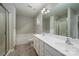 Bathroom featuring double sinks, a soaking tub, a shower with a glass door, and neutral colors at 14034 Cedar Pond Cir, Huntersville, NC 28078