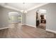 Formal dining room with hardwood floors leading to kitchen and living spaces at 14034 Cedar Pond Cir, Huntersville, NC 28078