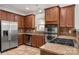 Modern kitchen with stainless steel appliances, tile backsplash and granite countertops at 14034 Cedar Pond Cir, Huntersville, NC 28078