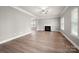 Spacious living room featuring a fireplace, hardwood floors, and natural light at 14034 Cedar Pond Cir, Huntersville, NC 28078