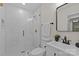 Modern bathroom featuring a tiled shower with glass enclosure and updated fixtures at 1814 Brookdale Ave, Charlotte, NC 28210