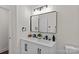 Bathroom with double sink vanity, sleek fixtures, and ample counter space at 1814 Brookdale Ave, Charlotte, NC 28210