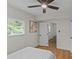Bright bedroom with a ceiling fan, natural light, and ensuite bathroom access creates an inviting space at 1814 Brookdale Ave, Charlotte, NC 28210