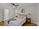 Charming bedroom with an ensuite bathroom, bright natural light, and hardwood floors at 1814 Brookdale Ave, Charlotte, NC 28210