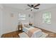 Inviting bedroom features hardwood floors, dual windows, and calming decor at 1814 Brookdale Ave, Charlotte, NC 28210