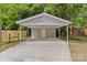 Detached carport provides covered parking with additional storage at 1814 Brookdale Ave, Charlotte, NC 28210