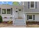 Welcoming front entrance features a classic white door with sidelights and a well-maintained brick facade at 1814 Brookdale Ave, Charlotte, NC 28210
