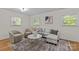 Inviting living room with neutral tones, modern furnishings, and plenty of natural light at 1814 Brookdale Ave, Charlotte, NC 28210