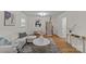 Open-concept living area features modern decor, hardwood floors, and plenty of natural light at 1814 Brookdale Ave, Charlotte, NC 28210