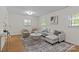 Living room with natural light, neutral decor, and a stylish rug at 1814 Brookdale Ave, Charlotte, NC 28210