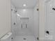 Modern shower with glass enclosure, tiled walls, and stylish fixtures at 1814 Brookdale Ave, Charlotte, NC 28210