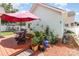Lovely backyard deck with an umbrella, patio set, and green garden areas offering a relaxing outdoor space at 186 Gresham Ln, Mooresville, NC 28117