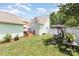 Lush backyard featuring a patio, seating area, and well-maintained lawn, ideal for outdoor enjoyment at 186 Gresham Ln, Mooresville, NC 28117
