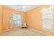 Comfortable bedroom with a vintage chair, complemented by a ceiling fan and natural light from dual windows at 186 Gresham Ln, Mooresville, NC 28117
