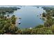 An aerial view displays waterfront homes and lush greenery along a pristine, beautiful lake at 188 Blarney Rd, Mooresville, NC 28117