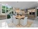 Bright and airy dining room with staircase, opening to a modern kitchen and abundant natural light at 188 Blarney Rd, Mooresville, NC 28117