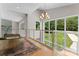 A bright foyer with modern staircase, gold chandelier, and big windows overlooking the green front yard at 188 Blarney Rd, Mooresville, NC 28117
