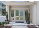 Elegant front entrance with double glass doors, stone accents, and decorative potted plants at 188 Blarney Rd, Mooresville, NC 28117