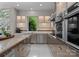 Modern kitchen with stainless steel appliances, stylish cabinets, and a bright window view at 188 Blarney Rd, Mooresville, NC 28117