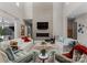 Modern living room featuring a stone accent wall, cozy seating, and a sleek fireplace at 188 Blarney Rd, Mooresville, NC 28117