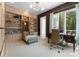 Home office with built-in bookshelves, a cozy reading nook, and a bright workspace at 188 Blarney Rd, Mooresville, NC 28117