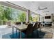 This outdoor living area features a dining area, luxury seating, and beautiful lake views at 188 Blarney Rd, Mooresville, NC 28117
