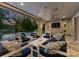 Covered patio with comfortable seating and outdoor television for entertaining at 188 Blarney Rd, Mooresville, NC 28117