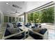 This outdoor living area features luxury seating, ceiling fans, and beautiful wooded views at 188 Blarney Rd, Mooresville, NC 28117