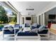 This outdoor living area features luxury seating, a tv, and beautiful views at 188 Blarney Rd, Mooresville, NC 28117