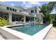 The in ground pool features a waterfall hot tub and access to the outdoor living area at 188 Blarney Rd, Mooresville, NC 28117