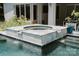 This in ground pool features a waterfall hot tub and manicured landscaping at 188 Blarney Rd, Mooresville, NC 28117