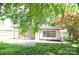 Backyard featuring a covered patio, lush ground cover, and privacy fencing at 2000 Tyvola Rd, Charlotte, NC 28210