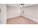 Bedroom with wood floors, a ceiling fan and a window providing natural light at 2000 Tyvola Rd, Charlotte, NC 28210