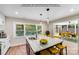 Stylish kitchen with large island, quartz countertops, and sunroom access at 2000 Tyvola Rd, Charlotte, NC 28210
