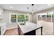 Modern kitchen featuring a large island, quartz countertops, and plenty of natural light at 2000 Tyvola Rd, Charlotte, NC 28210