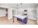 Kitchen featuring a large island with a sink, ample cabinet space, and stainless steel appliances at 2000 Tyvola Rd, Charlotte, NC 28210