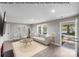 Virtually staged living room with modern furniture, light wood floors, and a cozy atmosphere at 2000 Tyvola Rd, Charlotte, NC 28210