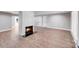 Living room showcasing a fireplace, light wood floors, and a spacious open layout at 2000 Tyvola Rd, Charlotte, NC 28210